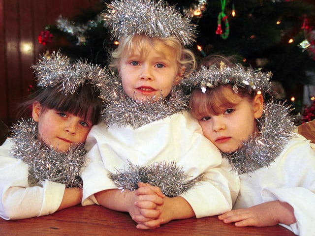 Primary one pupils Amy McLay, Hope McNicoll and Deaven Howarth are angels in their school nativity play. Picture: 15 December 2000