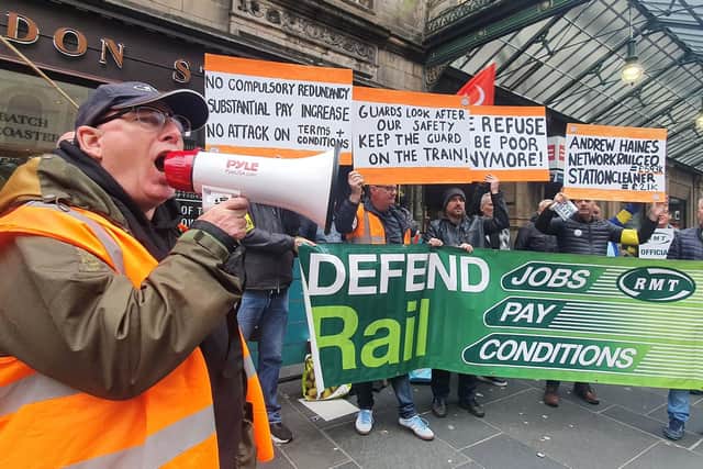 Striking rail workers at Glasgow Central Station as part of the Network Rail dispute which halted most trains (Picture: John Devlin)