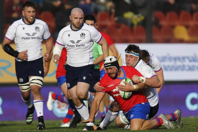 Ben Muncaster of Scotland stops Chile's Vittorio Lastra during the tourists' win in Santiago. (Photo by Marcelo Hernandez/Getty Images)