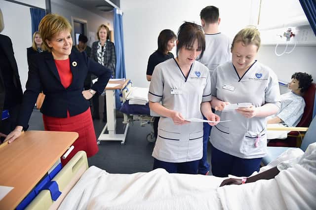 First Minister Nicola Sturgeon watches students on a mock hospital ward at Queen Margaret University in 2016 (Picture: Jeff J Mitchell/Getty Images)