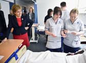 First Minister Nicola Sturgeon watches students on a mock hospital ward at Queen Margaret University in 2016 (Picture: Jeff J Mitchell/Getty Images)