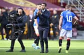 Rangers manager Giovanni van Bronckhorst takes the acclaim of the Rangers fans at full time.