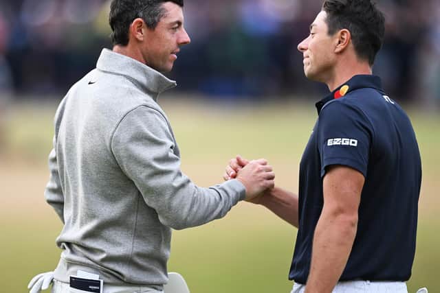 Viktor Hovland and Rory McIlroy shake hands on the 18th green after the third round of the 150th Open at St Andrews. Picture: Ian Rutherford.
