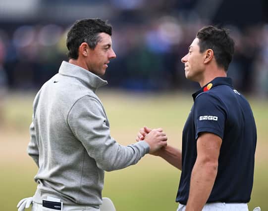 Viktor Hovland and Rory McIlroy shake hands on the 18th green after the third round of the 150th Open at St Andrews. Picture: Ian Rutherford.