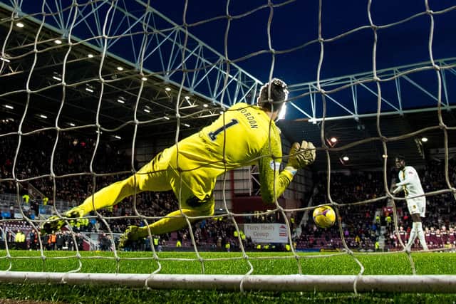 Hearts keeper Craig Gordon saves Ayo Obileye's penalty.
