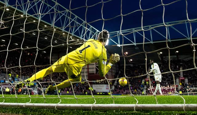 Hearts keeper Craig Gordon saves Ayo Obileye's penalty.