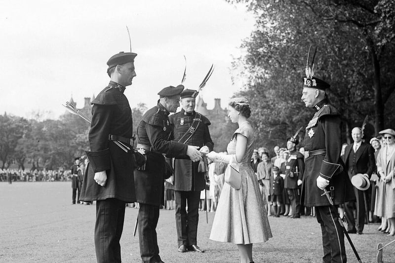 The Queen is pictured presenting prizes to Major AC Blair during the visit to the Meadows.