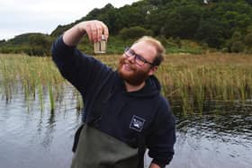 Adam Button, invertebrate keeper for the RZSS, was one of the team who helped collect leeches from a Scottish loch to begin the pioneeering reintroduction project