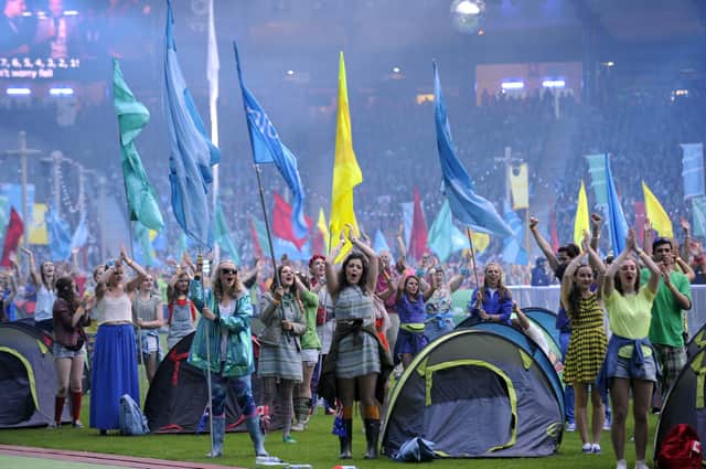 Volunteers perform during the closing ceremony of the 2014 Commonwealth Games at Hampden Park in Glasgow (Picture: Andy Buchanan/AFP via Getty Images)