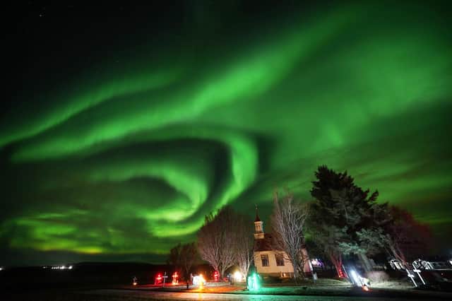 The northern lights over Villingaholtskirkja Church on the south coast of Iceland. Picture date: Sunday November 27, 2022. PA Photo. Photo credit should read: Owen Humphreys/PA Wire
