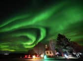 The northern lights over Villingaholtskirkja Church on the south coast of Iceland. Picture date: Sunday November 27, 2022. PA Photo. Photo credit should read: Owen Humphreys/PA Wire