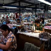 Labours work at a garment factory in Yangon in 2018.