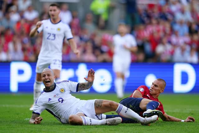 Lyndon Dykes slides home Scotland's equaliser against Norway. Pic: Zac Goodwin/PA Wire.
