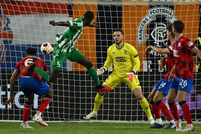 Aris Limassol's Alex Moucketou-Moussounda heads home the opener against Rangers in Cyprus.