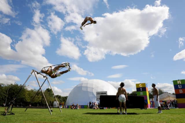 An acrobat from La Meute flies over the Circus Hub, the Meadows venue first launched in 2015 by Underbelly. Picture: Jane Barlow