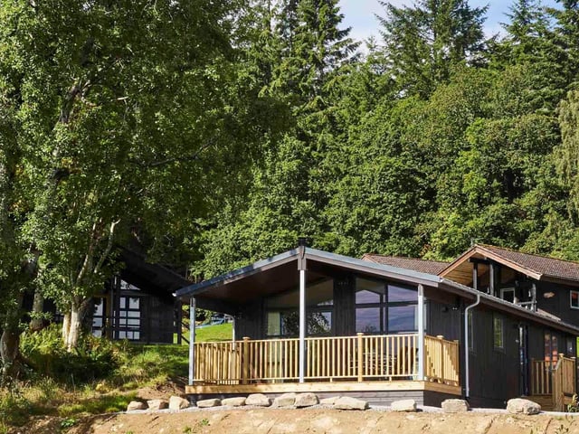 The beautiful Lochside Lodge is available to buy at Loch Tay Highland Lodges.