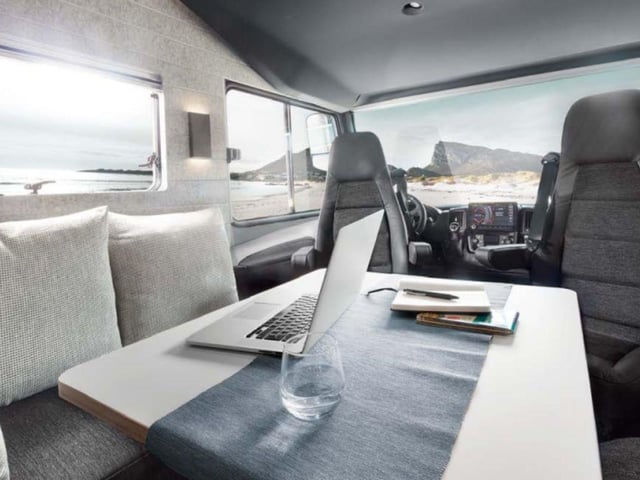 The open-plan living space has a cosy face-to-face lounge area and enough room for five people - including on an ingenious optional bench seat that transforms from a
safe passenger seat into a couch.