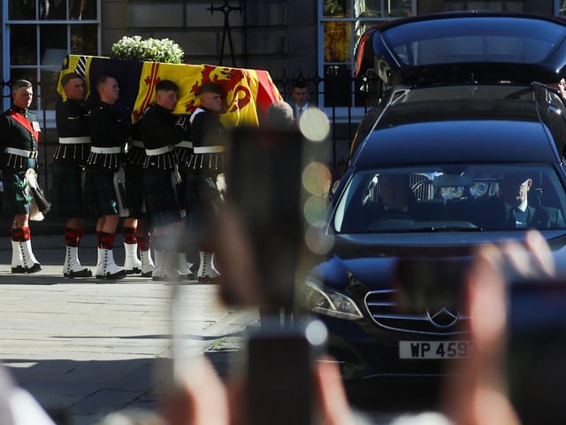 Pallbearers carry the coffin of Queen Elizabeth II from St Giles' Cathedral, Edinburgh, after a prayer service.