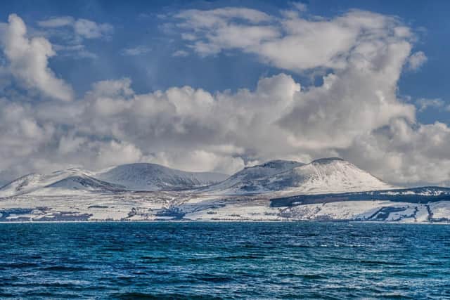 A view of Arran in Winter from Kintyre, where Meyrick's novels are set.