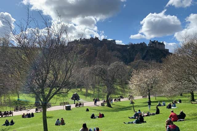 Dozens of Edinburgh residents watched the gun salute at the Castle from Princes Street Gardens.