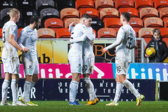DUNDEE, SCOTLAND - DECEMBER 26: Hibernian's Kevin Nisbet (centre) celebrates making it 1-0 with Martin Boyle during a Cinch Premiership match between Dundee United and Hibernian at Tannadice Park, on December 26, 2021, in Dundee, Scotland.  (Photo by Ross Parker / SNS Group)