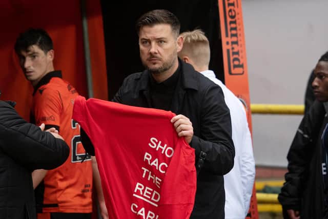 Dundee United manager Tam Courts used a 'show racism the red card' t-shirt to get his message across after an alleged incident at the weekend. (Photo by Mark Scates / SNS Group)