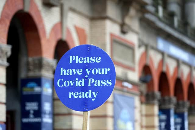 Covid signage in London. A US health agency has recommended halving the isolation time linked to Covid cases. Picture: Bradley Collyer/PA Wire