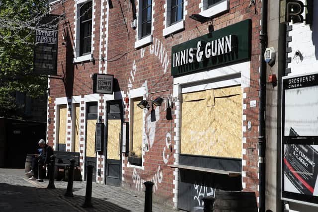 Boarded up restaurants and pubs in Glasgow.