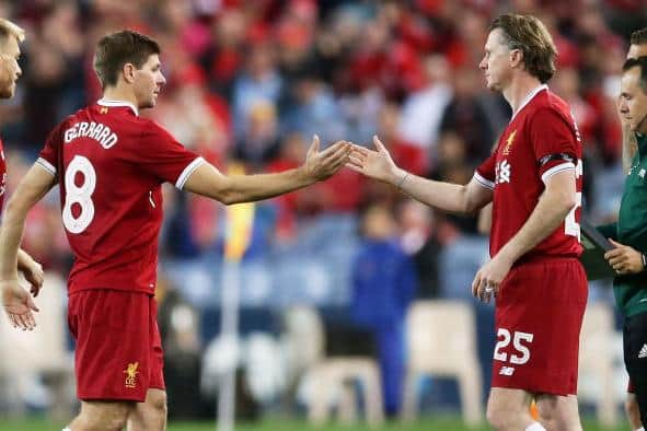 Steven Gerrard is substituted by Steve McManaman of Liverpool during an international friendly in Sydney, Australia.  (Photo by Matt King/Getty Images)