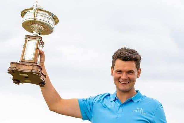 Craigielaw's Angus Carrick with the trophy after his win in the 2021 Scottish Amateur Championship at Murcar Links. Picture: Scottish Golf.