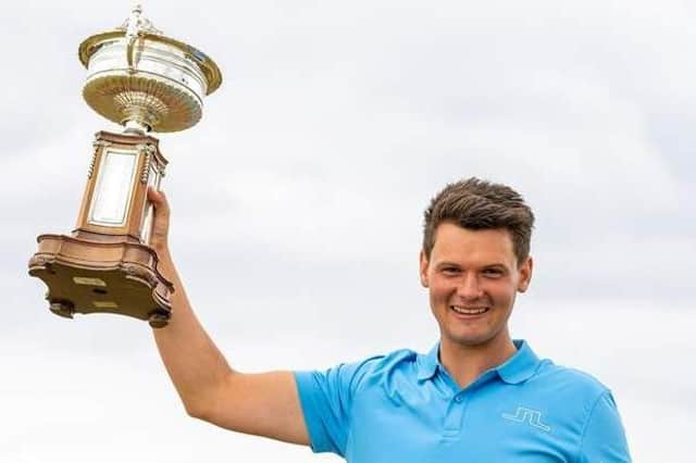 Craigielaw's Angus Carrick with the trophy after his win in the 2021 Scottish Amateur Championship at Murcar Links. Picture: Scottish Golf.