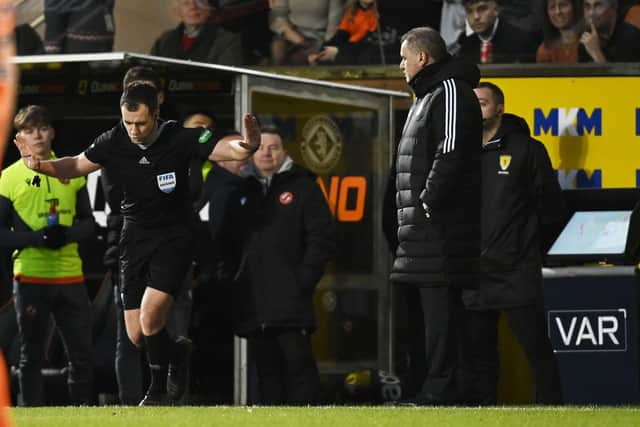 Celtic manager Ange Postecoglou watches on as referee Don Robertson rules out a penalty award.