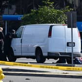 California police hunting the gunman who killed 10 people at a dance club during Lunar New Year celebrations broke into a van after a lengthy standoff Sunday, where images showed a body slumped in the driver's seat. The hunt began 12 hours earlier after a man -- described by police as Asian -- began firing at a club in Monterey Park, a city in Los Angeles County with a large Asian community.(Photo by ROBYN BECK/AFP via Getty Images)