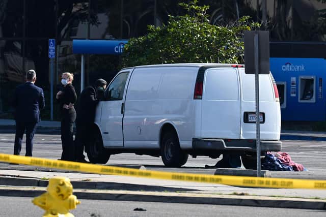 California police hunting the gunman who killed 10 people at a dance club during Lunar New Year celebrations broke into a van after a lengthy standoff Sunday, where images showed a body slumped in the driver's seat. The hunt began 12 hours earlier after a man -- described by police as Asian -- began firing at a club in Monterey Park, a city in Los Angeles County with a large Asian community.(Photo by ROBYN BECK/AFP via Getty Images)
