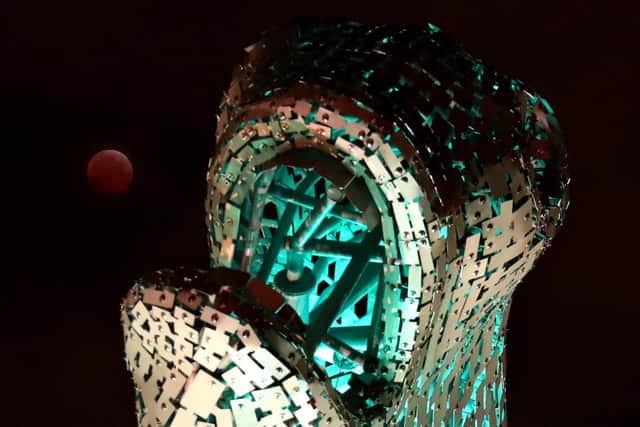 A super blood wolf moon next to one of The Kelpies near Falkirk during a lunar eclipse.