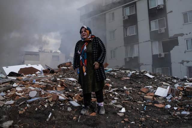 A woman waits for news of her loved ones, believed to be trapped under a collapsed building in Iskenderun, Turkey. A 7.8-magnitude earthquake hit near Gaziantep, Turkey, in the early hours of Monday, followed by another 7.5-magnitude tremor just after midday.