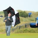 Bob MacIntyre has a laugh with Greg Milne, his caddie at the time, and coach David Burns during a practice round for the 148th Open Championshipat Royal Portrush in 2019. Picture: Andrew Redington/Getty Images.