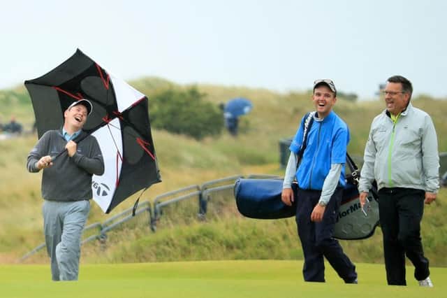 Bob MacIntyre has a laugh with Greg Milne, his caddie at the time, and coach David Burns during a practice round for the 148th Open Championshipat Royal Portrush in 2019. Picture: Andrew Redington/Getty Images.