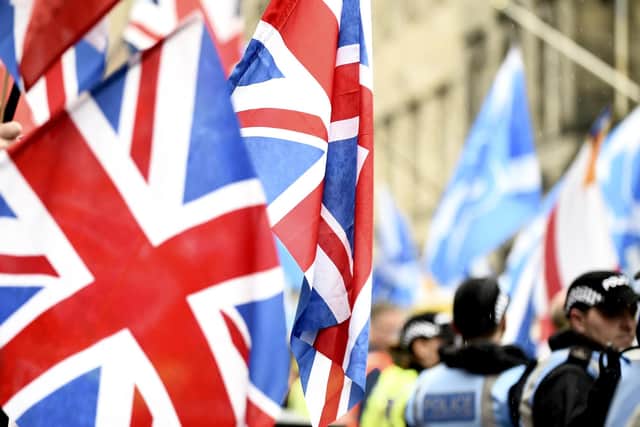 Flags on display during march through the streets of Edinburgh in 2019. Picture: Lisa Ferguson