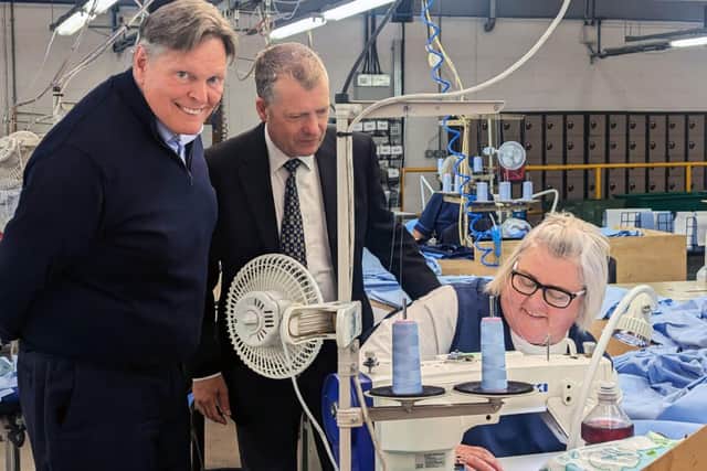 MSPs Stephen Kerr, left and Graham Simpson with Haven Products worker Mary White.