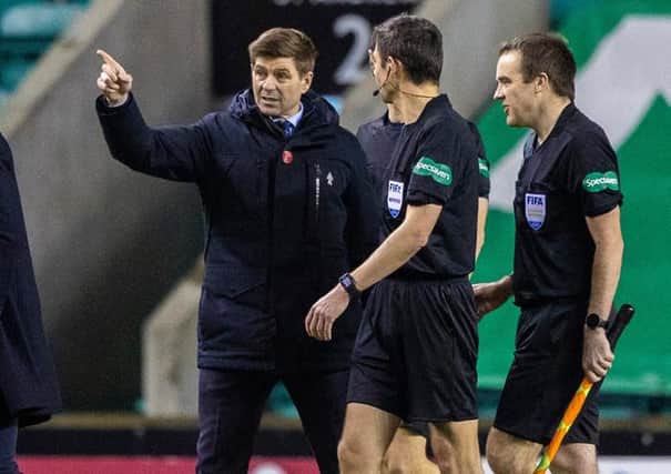 Rangers manager Steven Gerrard speaks to referee Kevin Clancy at full-time after his team's 1-0 win over Hibs at Easter Road. (Photo by Craig Williamson / SNS Group)