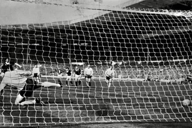 Jim Baxter scores for Scotland against England at Wembley in 1963.