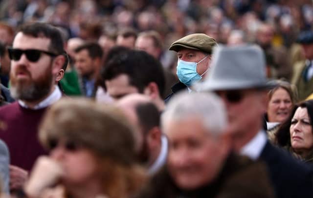 Face coverings will no longer be required in shops, restaurants or on public transport from April 18. Photo by Adrian DENNIS / AFP) (Photo by ADRIAN DENNIS/AFP via Getty Images