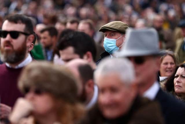 Face coverings will no longer be required in shops, restaurants or on public transport from April 18. Photo by Adrian DENNIS / AFP) (Photo by ADRIAN DENNIS/AFP via Getty Images