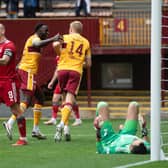 Aberdeen's Scott Brown looks frustrated as Juhani Ojala makes it 2-0 for Motherwell at Fir Park.