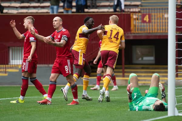Aberdeen's Scott Brown looks frustrated as Juhani Ojala makes it 2-0 for Motherwell at Fir Park.