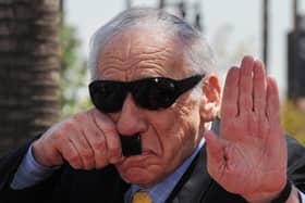Mel Brooks, who co-wrote and directed Blazing Saddles, does a impersonation of Adolf Hitler whom he jokingly thanked for helping launch his career as a comedian (Picture: Mark Ralston/AFP via Getty Images)