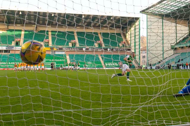 Hibs' Ryan Porteous scores the winner from the penalty spot against Motherwell.