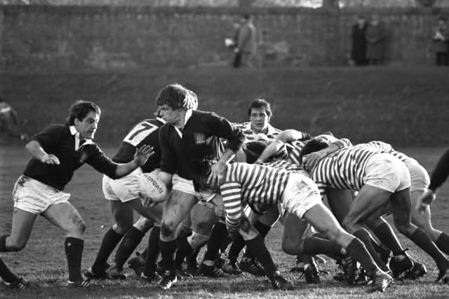 Finlay Calder passes to twin brother Jim, left, during Edinburgh's 17-10 win over Anglo-Scots in December 1986.  Picture: Denis Straughan/The Scotsman