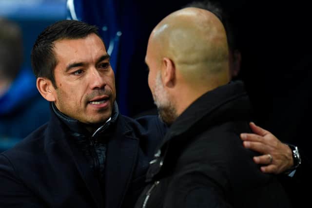 Giovanni van Bronckhorst with Pep Guardiola when his Feyenoord side took on Manchester City in the Champions League in 2017. (Photo by OLI SCARFF/AFP via Getty Images)